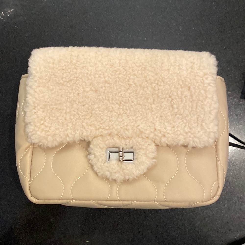 Beautiful new purse/crossbody. Brand new never used. Silver colored hardware.